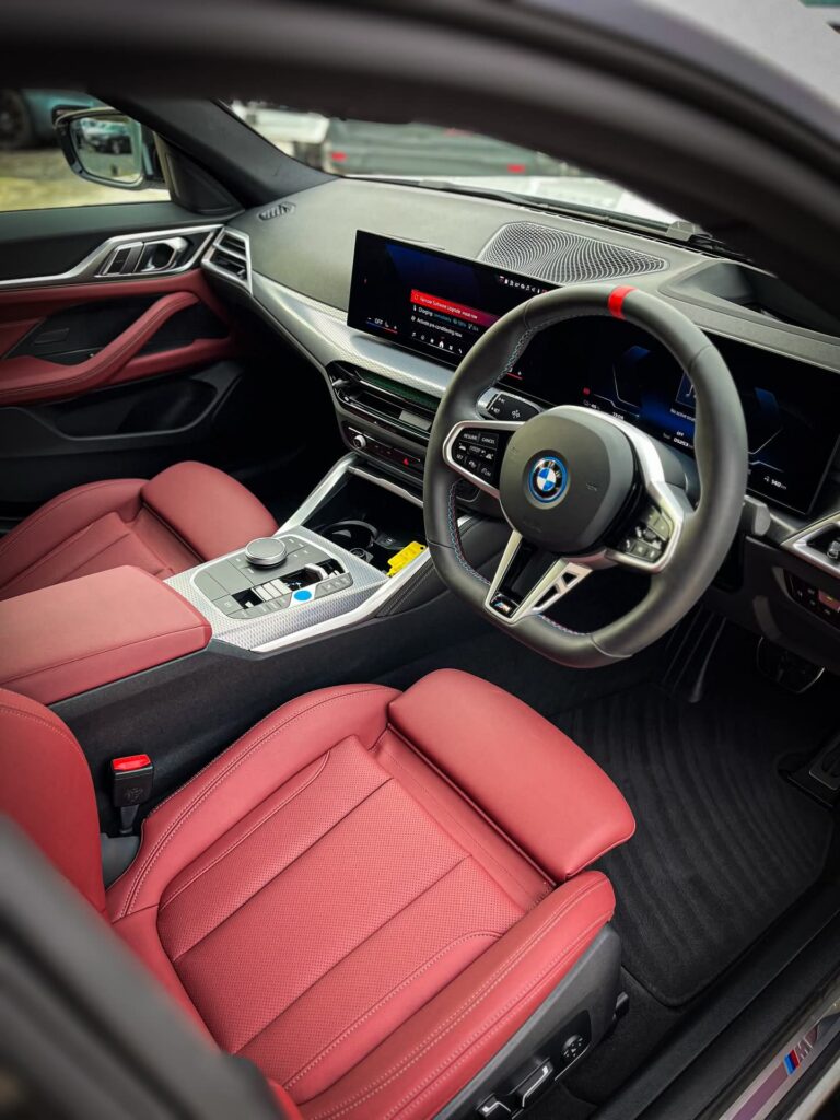 BMW i4 M50 interior dashboard with curved digital display