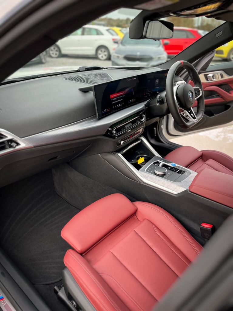 BMW i4 M50 interior dashboard with curved digital display