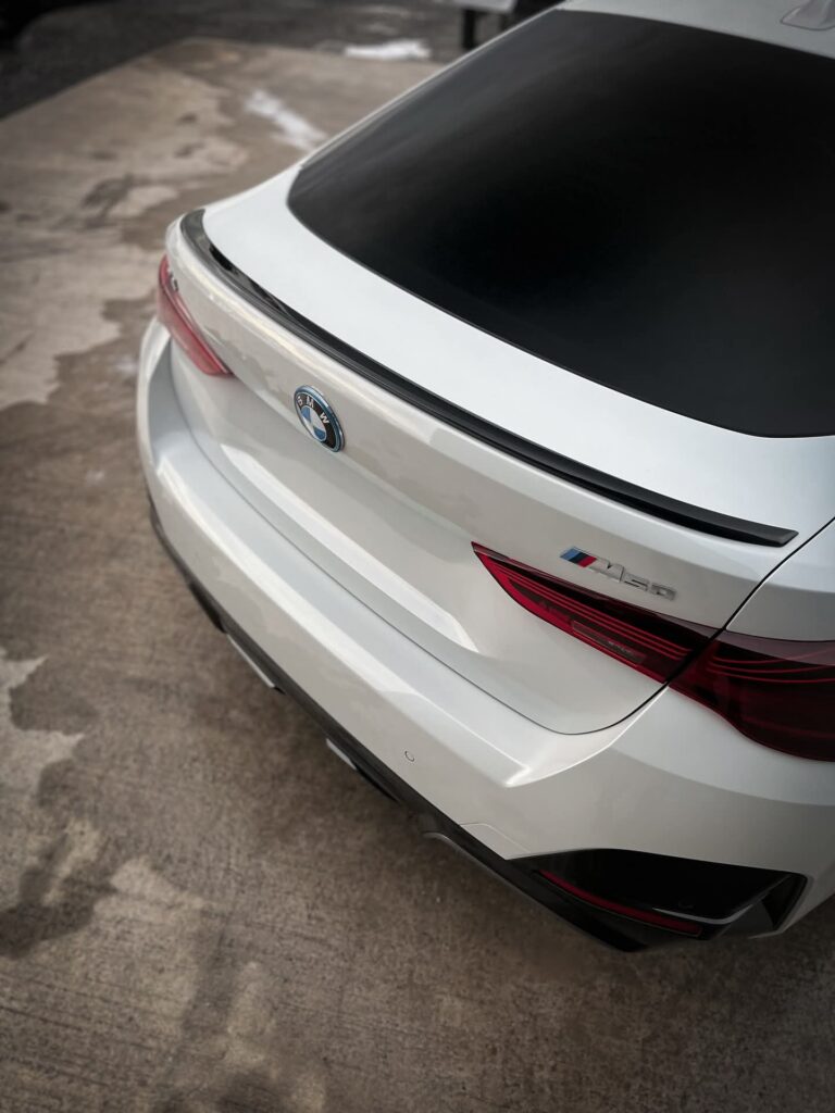 BMW i4 M50 rear view showing LED taillights and M badge
